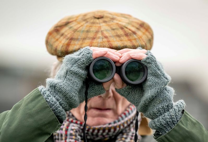 Racegoer with binoculars
